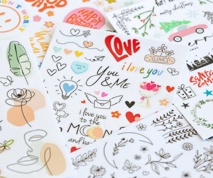 Vielfältige Rub-on-Sticker mit floralen Motiven, Herzen, Schriftzügen und saisonalen Designs bieten unzählige Möglichkeiten zum kreativen Verzieren und Personalisieren von DIY-Projekten.
